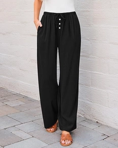 Detail view of high-waisted black wide-leg pants with buttons and adjustable drawstring