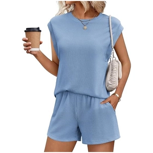 Detail of light blue ribbed knit fabric on women's casual two-piece summer shorts set