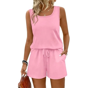 Detail of pink summer set shorts featuring elastic waistband, drawstring, and side pockets