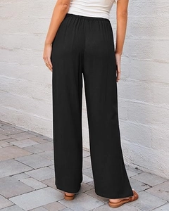 Back view of high-waist black wide-leg trousers with elastic waistband on a model