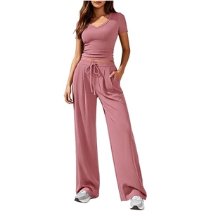Detail of knit ribbed texture on v-neck top and high waist wide leg pants set