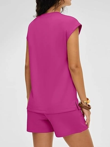 Detail of fuchsia two-piece summer set with side-slit top and elastic shorts back view