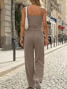 Chic women's two-piece set featuring a strap camisole and wide-leg pants in taupe