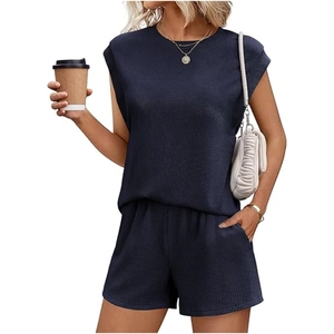Detailed texture of navy ribbed knit fabric on women's two-piece casual short set