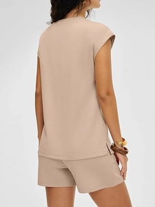 Detail view of the side slit on a beige women's casual t-shirt and shorts set
