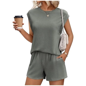 Detailed close-up of sage green ribbed knit texture on women's casual two-piece summer set