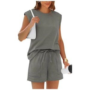 Detail of grey sleeveless top and drawstring shorts with large pockets for summer