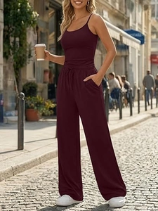 Detail of burgundy lounge set featuring spaghetti strap top and high-waisted wide-leg pants