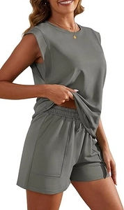 Detail of sage green summer set showing the crewneck top and side pocket shorts