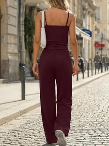 Rear view of wine red sleeveless wide-leg jumpsuit with backless design in street style