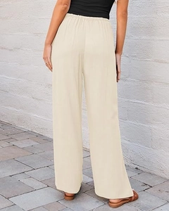 Back view of high-waisted wide-leg trousers in beige with elasticated waistband detail
