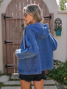 Detail of blue washed denim jacket with white drawstring hood and high-quality fabric texture