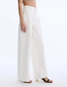 Detailed back view of high-waisted wide-leg white denim trousers for women with elegant drape