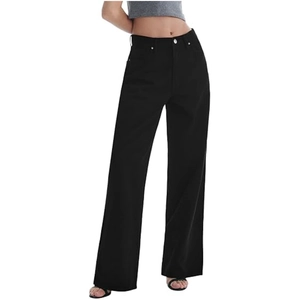 Detail shot of black high-waisted wide-leg denim pants with silver button and rivet accents