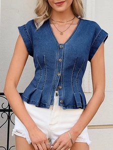 Detail of slim fit denim vest showing V-neckline, metal buttons and pleated hem design