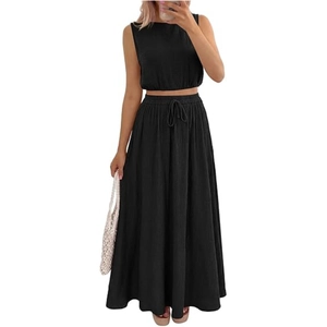 Detail of black two-piece summer set showing sleeveless crop top and maxi skirt with pockets