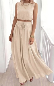 Detail view of beige cotton two-piece set showing textured fabric and elastic drawstring waist