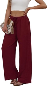 Detail of burgundy wide-leg pants featuring elastic drawstring waist and pleated texture