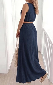 Close-up of dark blue summer set showing pleated fabric texture and sleeveless crop top