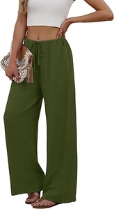 Detailed close-up of green wide-leg trousers with elastic drawstring waist and textured fabric