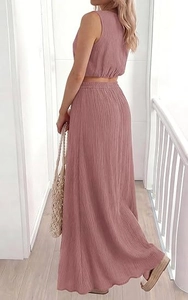 Detail of dusty rose crop top and high-waisted skirt set with textured cotton fabric