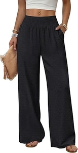 Detail der hohen Taille mit Smokbund und Strukturstoff bei schwarzer weiter Hose