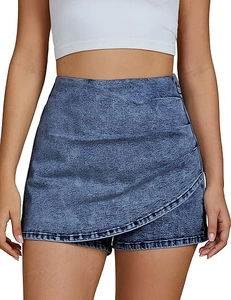 Detailed close-up of high-waisted asymmetric denim skort with vintage snow wash blue texture