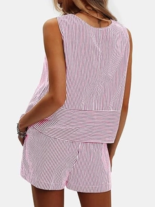 Rear view of women's red and white striped sleeveless top and shorts set in summer