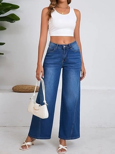 Detailed view of high waist wide leg blue denim jeans with decorative vertical seams