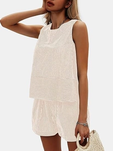 Detailed texture of beige vertical striped sleeveless top and shorts summer set