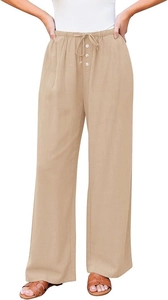 Detail van de wijde broek met trekkoord in de taille en witte sierknoppen
