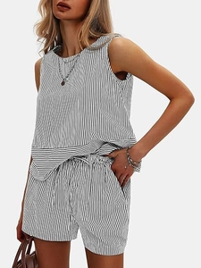 Close-up detail of the black and white striped fabric texture on the summer two-piece set
