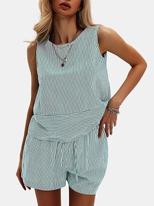 Detail of blue and white vertical stripe pattern on women's sleeveless set and drawstring shorts