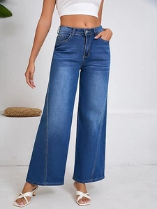 Detail view of high-waisted blue wide-leg jeans with unique diagonal stitching