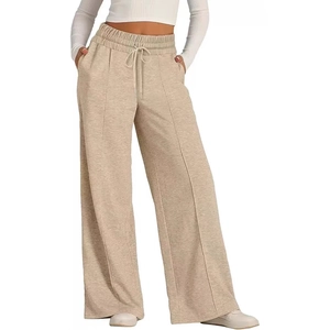 Pantalon de jogging beige à jambes larges avec cordon de serrage et coutures verticales
