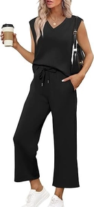 Detail of the drawstring elastic waist and side pockets on black wide-leg trousers