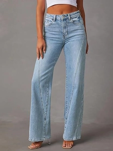 Detail shot of high-waisted wide-leg jeans with unique diagonal stitching and light blue wash