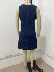 Detail view of the back of a dark blue denim sleeveless dress with princess seams