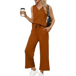 Detail of caramel v-neck sleeveless top and high-waist drawstring wide-leg pants