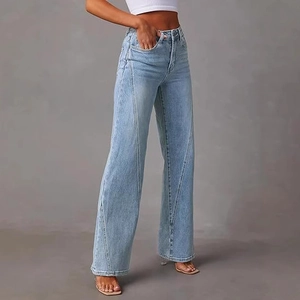 High-waisted wide-leg jeans in light blue denim with diagonal patchwork stitch design