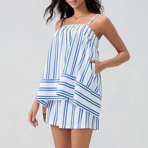 Detail of blue and white striped summer set featuring smocked tank top and matching shorts