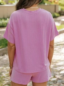 Back view of a pink and white striped two-piece lounge set with soft textured fabric