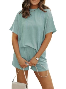 Detailed view of light green striped fabric on a casual women's summer two-piece set