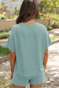 Rear view of a sage green ribbed lounge set featuring short sleeve top and matching shorts
