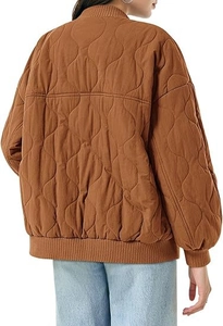 Rear view of women's oversized brown wave-quilted bomber jacket with ribbed knit trims