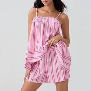 Detailed view of pink striped satin pajama set featuring camisole top and matching shorts