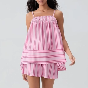 Close-up of pink and white striped camisole top with smocked chest detail and matching shorts