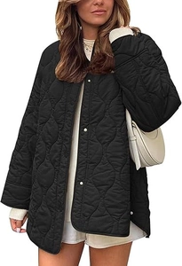 Detail of black quilted jacket featuring wave stitching texture and silver snap buttons