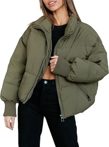 Close-up of olive puffer jacket featuring stand collar, silver zipper and ribbed cuffs