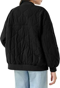 Detailed back view of a black quilted bomber jacket featuring wavy stitching and rib knit trim